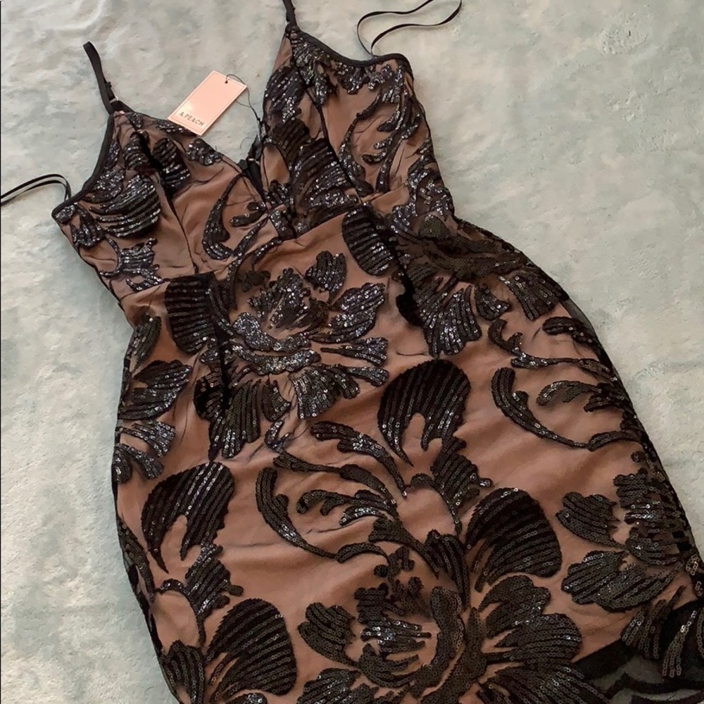 Nude w Black Sequined Overlay. Plunging Neckline.